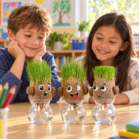 Two smiling kids with three grass head dolls in a classroom