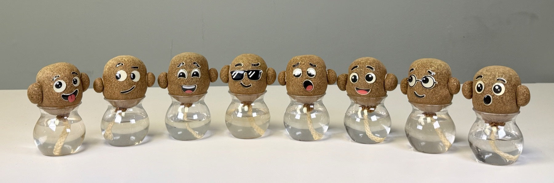 The Growbies crew on day zero: all eight personalities, hair still to come